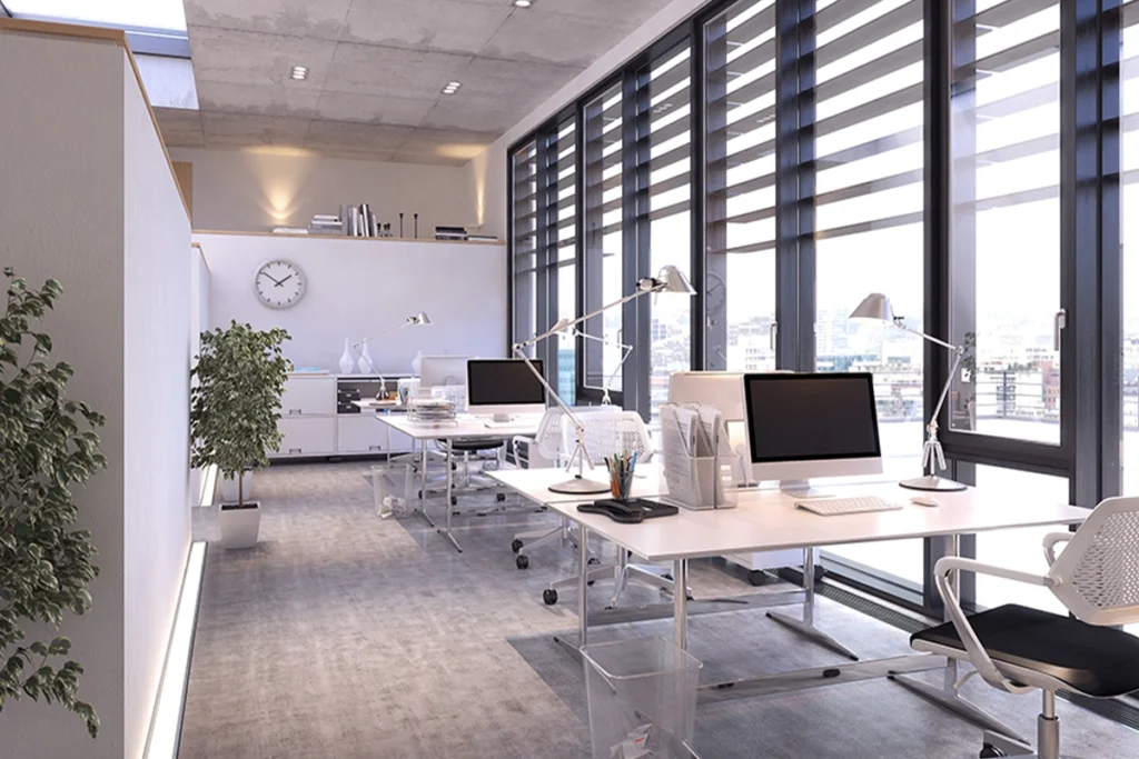 Modern eingerichtetes Großraumbüro mit ergonomischen Arbeitsplätzen und Tageslicht – professionelle Büroeinrichtung für produktives Arbeiten.